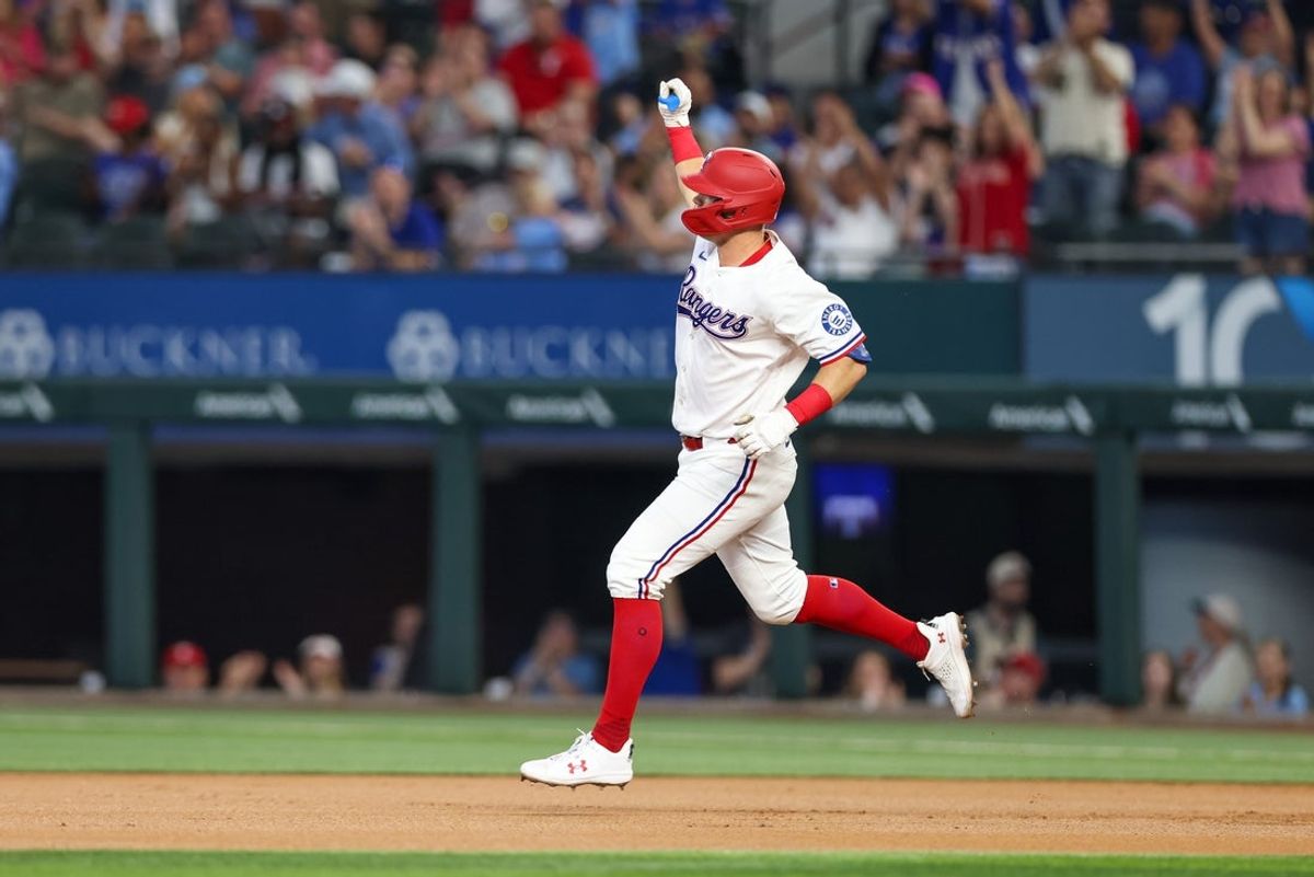 May 30, 2026; Arlington, Texas, USA; Texas Rangers third baseman Josh Jung (6) hits a home run during the first inning against the Kansas City Royals at Globe Life Field. Mandatory Credit: Andrew Dieb-Imagn Images