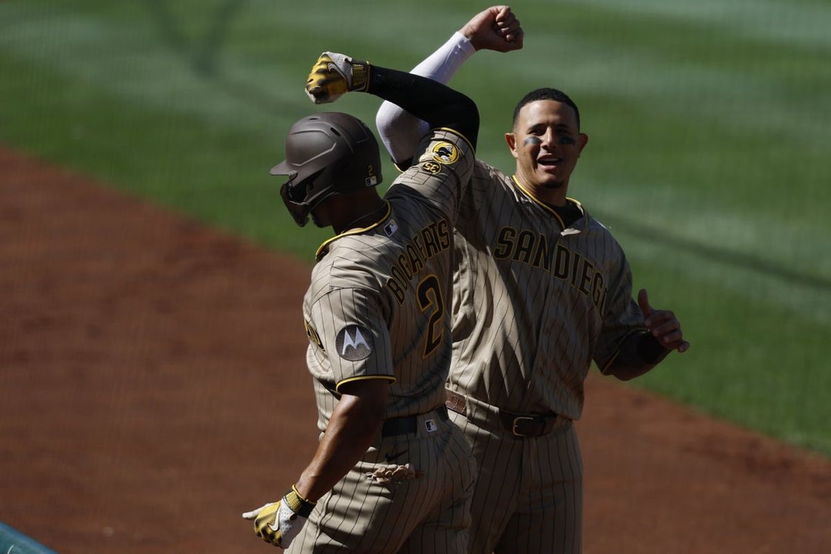 May 30, 2026; Washington, District of Columbia, USA; San Diego Padres shortstop Xander Bogaerts (2) celebrates with Padres third baseman Manny Machado (13) after hitting a solo home run Washington Nationals during the second inning at Nationals Park. Mandatory Credit: Geoff Burke-Imagn Images