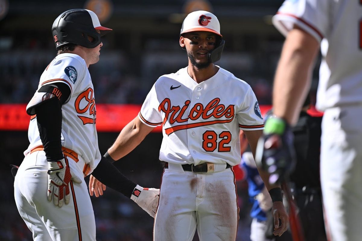 May 30, 2026; Baltimore, Maryland, USA;  Baltimore Orioles infielder Jeremiah Jackson (82) is congratulated by catcher Adley Rutschman (35)  after scoring a run in the third inning against the Toronto Blue Jays at Oriole Park at Camden Yards. Mandatory Credit: Jamie Sabau-Imagn Images
