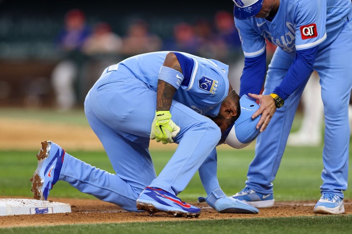 May 30, 2026; Arlington, Texas, USA; Kansas City Royals third baseman Maikel Garcia (11) comes up with a leg injury during the seventh inning against the Texas Rangers at Globe Life Field. Mandatory Credit: Andrew Dieb-Imagn Images