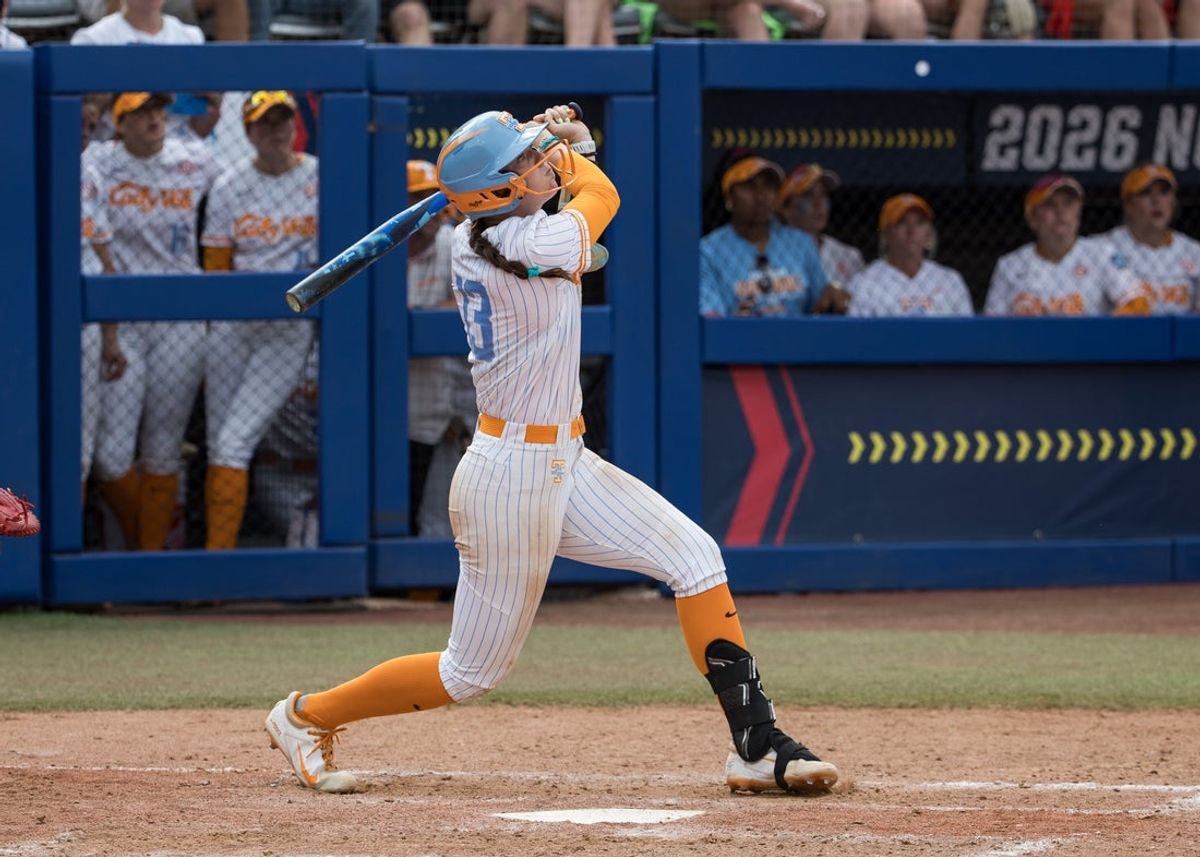 May 30, 2026; Oklahoma City, OK, USA;  Tennessee Lady Volunteers infielder Emma Clarke (13) hits a walk-off home run in the ninth inning beating the Texas Tech Red Raiders during the NCAA Women’s College World Series at Devon Park. Mandatory Credit: Brett Rojo-Imagn Images