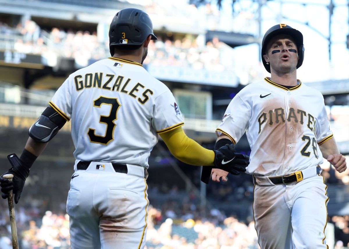 May 30, 2026; Pittsburgh, Pennsylvania, USA;  Pittsburgh Pirates third baseman Nick Gonzales (3) greets left fielder Jake Mangum (28) crossing home plate to score a run against the Minnesota Twins during the seventh inning at PNC Park. Mandatory Credit: Charles LeClaire-Imagn Images