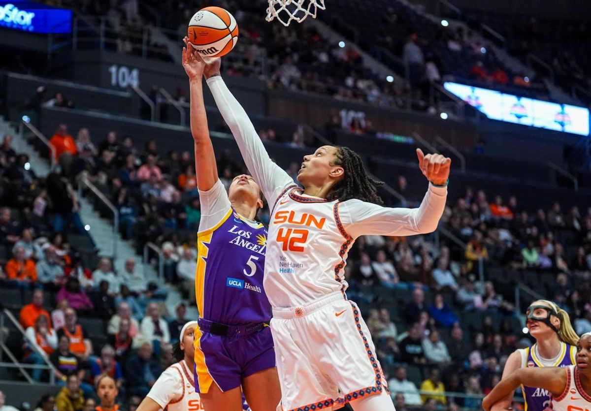 May 30, 2026; Hartford, Connecticut, USA; Connecticut Sun center Brittney Griner (42) defends against Los Angeles Sparks forward Dearica Hamby (5) in the first half at PeoplesBank Arena. Mandatory Credit: David Butler II-Imagn Images