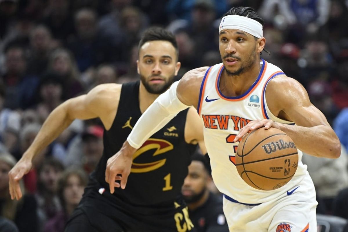 Mar 3, 2024; Cleveland, Ohio, USA; New York Knicks guard Josh Hart (3) dribbles beside Cleveland Cavaliers guard Max Strus (1) in the second quarter at Rocket Mortgage FieldHouse.