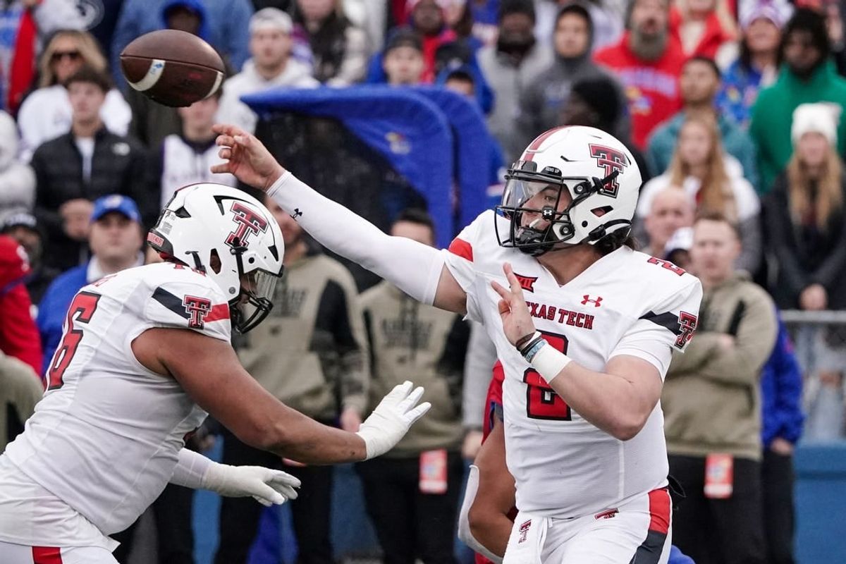 Nov 11, 2023; Lawrence, Kansas, USA; Texas Tech Red Raiders quarterback Behren Morton (2) throws a pass against the Kansas Jayhawks during the second half at David Booth Kansas Memorial Stadium.