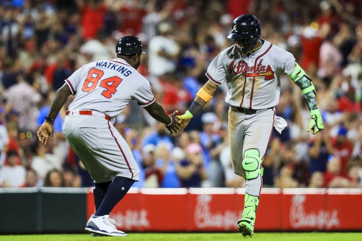 May 30, 2026; Cincinnati, Ohio, USA; Atlanta Braves outfielder Ronald Acuna Jr. (13) high fives third base coach Tommy Watkins (84) after hitting a solo home run in the ninth inning against the Cincinnati Reds at Great American Ball Park. Mandatory Credit: Katie Stratman-Imagn Images