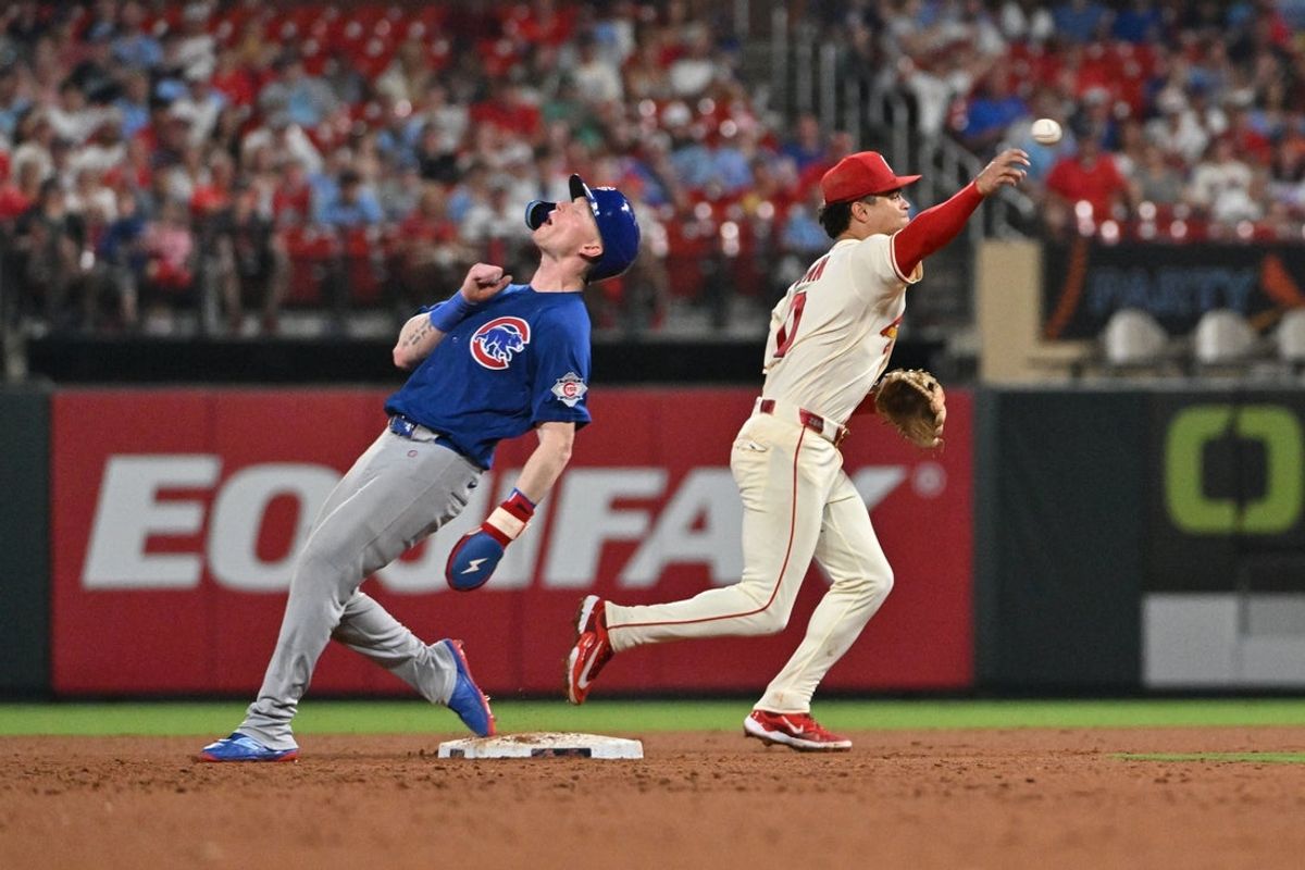 May 30, 2026; St. Louis, Missouri, USA; Chicago Cubs center fielder Pete Crow-Armstrong (4) reacts as St. Louis Cardinals shortstop Masyn Winn (0) throws to complete the double play against Nico Hoerner at Busch Stadium. Mandatory Credit: Jeff Le-Imagn Images