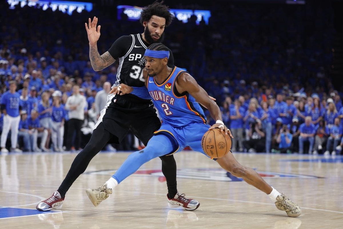 May 30, 2026; Oklahoma City, Oklahoma, USA; Oklahoma City Thunder guard Shai Gilgeous-Alexander (2) controls the ball against San Antonio Spurs forward Julian Champagnie (30) in the fourth quarter during game seven of the western conference finals for the 2026 NBA playoffs at Paycom Center. Mandatory Credit: Alonzo Adams-Imagn Images