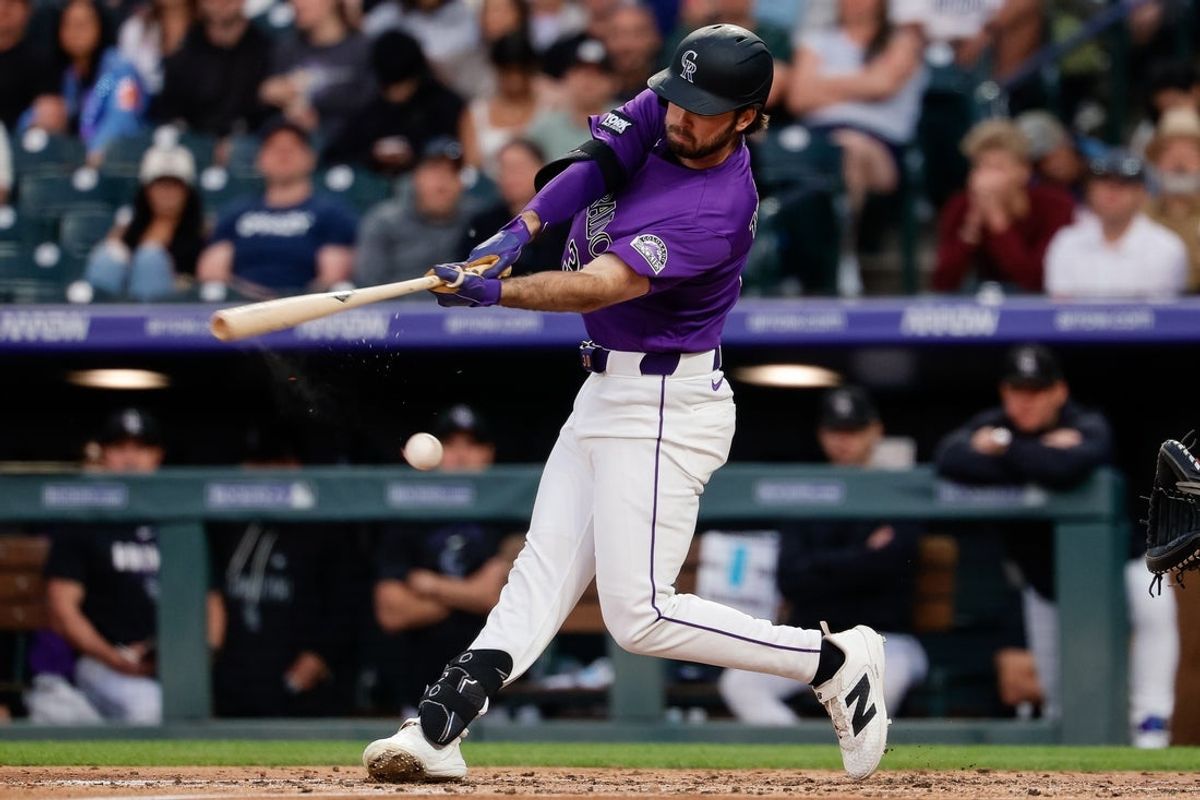 May 30, 2026; Denver, Colorado, USA; The seam of the baseball rips on a swing from Colorado Rockies left fielder Sterlin Thompson (30) in the third inning against the San Francisco Giants at Coors Field. Mandatory Credit: Isaiah J. Downing-Imagn Images