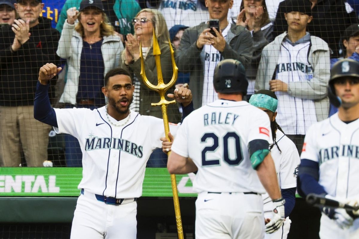 May 30, 2026; Seattle, Washington, USA; Seattle Mariners center fielder Julio Rodríguez (44) cheers a solo-home run by right fielder Luke Raley (20) against the Arizona Diamondbacks during the second inning at T-Mobile Park. Mandatory Credit: Joe Nicholson-Imagn Images