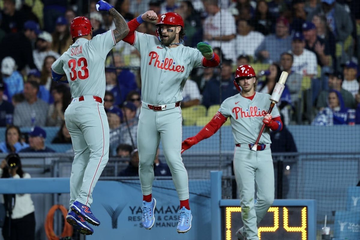 May 30, 2026; Los Angeles, California, USA;  Philadelphia Phillies second baseman Edmundo Sosa (33) celebrates his two-run home run with Philadelphia Phillies first baseman Bryce Harper (middle) during the eighth inning against the Los Angeles Dodgers at Dodger Stadium. Mandatory Credit: Kiyoshi Mio-Imagn Images