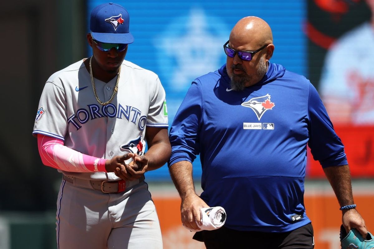 May 31, 2026; Baltimore, Maryland, USA; Toronto Blue Jays right fielder Jesus Sanchez (12) gets injured during the sixth inning against the Baltimore Orioles at Oriole Park at Camden Yards. Mandatory Credit: Daniel Kucin Jr.-Imagn Images