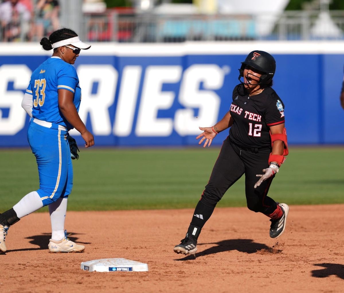 Jasmyn Burns (12) rounds the bases after hitting a homerun during the Women's College World Series softball game between Texas Tech Red Raiders and the UCLA Bruins at Devon Park in Oklahoma City, May 31, 2026.