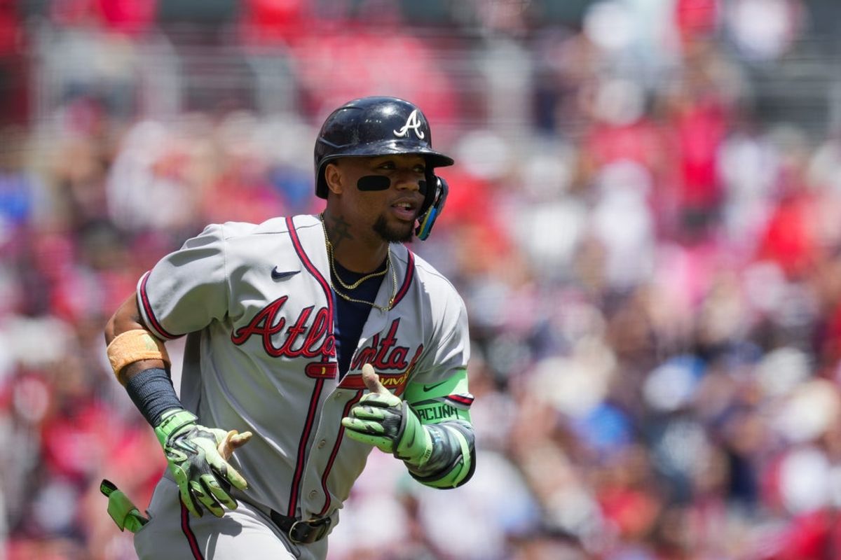 May 31, 2026; Cincinnati, Ohio, USA;  Atlanta Braves outfielder Ronald Acuna Jr. (13) hits a solo home run against the Cincinnati Reds at Great American Ball Park. Mandatory Credit: Aaron Doster-Imagn Images