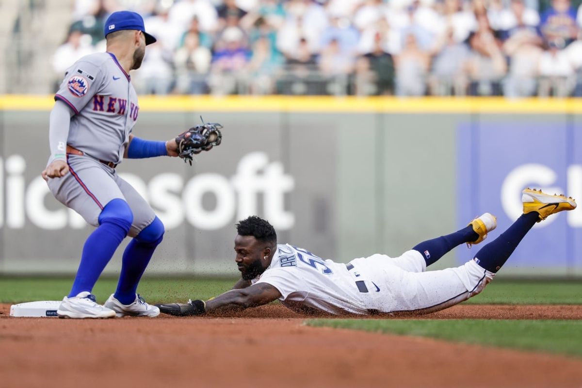 Jun 1, 2026; Seattle, Washington, USA; Seattle Mariners left fielder Randy Arozarena (56) steals second base before New York Mets shortstop Bo Bichette (19) can apply a tag during the second inning at T-Mobile Park. Mandatory Credit: Joe Nicholson-Imagn Images