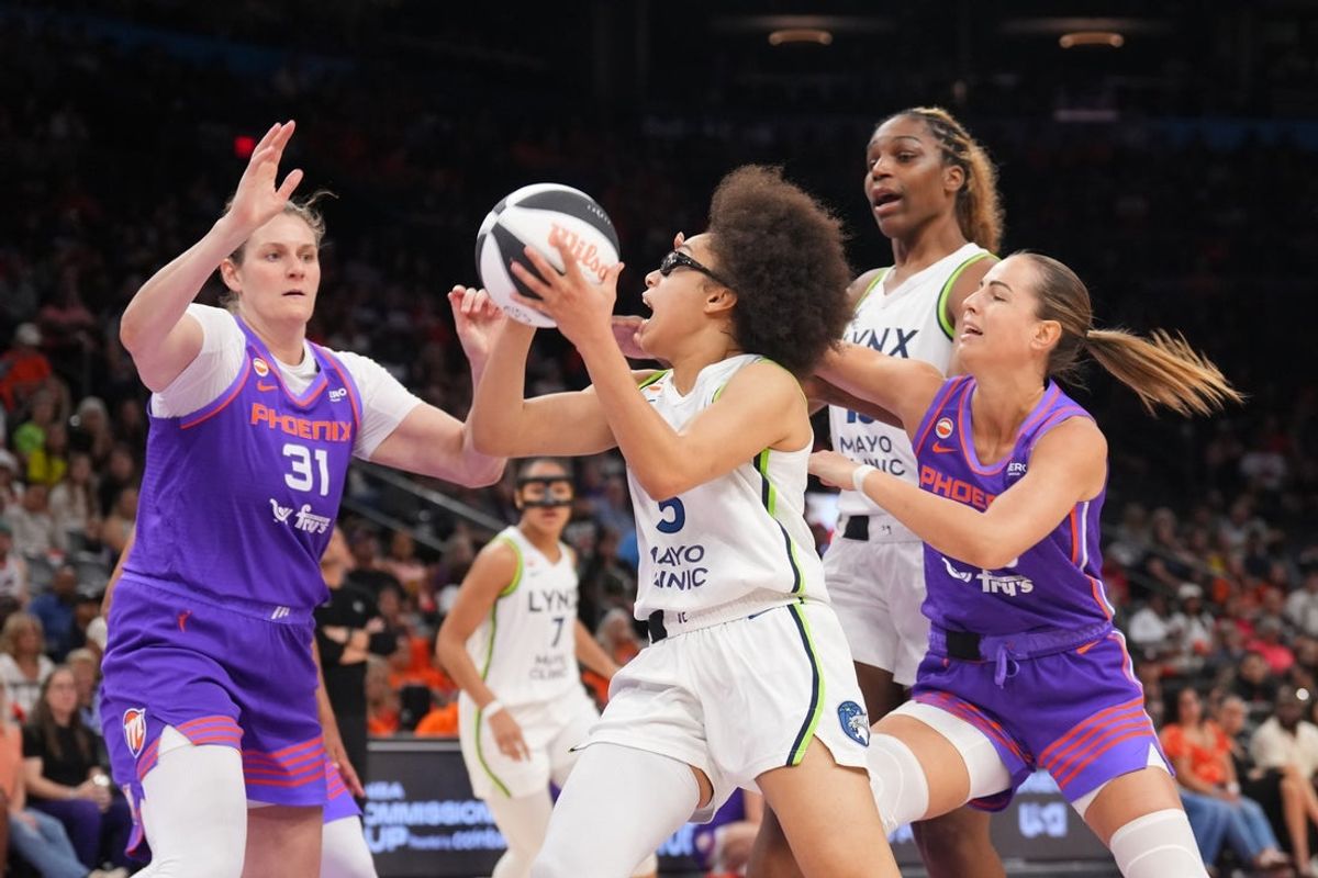 Jun 1, 2026; Phoenix, Arizona, USA; Minnesota Lynx guard Olivia Miles (5) drives against the Phoenix Mercury during the second half at Mortgage Matchup Center. Mandatory Credit: Joe Camporeale-Imagn Images