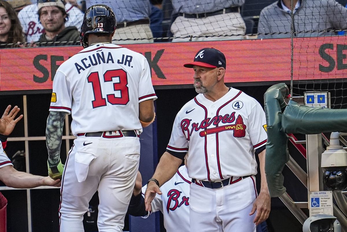 Jun 2, 2026; Cumberland, Georgia, USA; Atlanta Braves right fielder Ronald Acuna Jr. (13) reacts with manager Walt Weiss (22) after scoring a run against the Toronto Blue Jays during the first inning at Truist Park. Mandatory Credit: Dale Zanine-Imagn Images