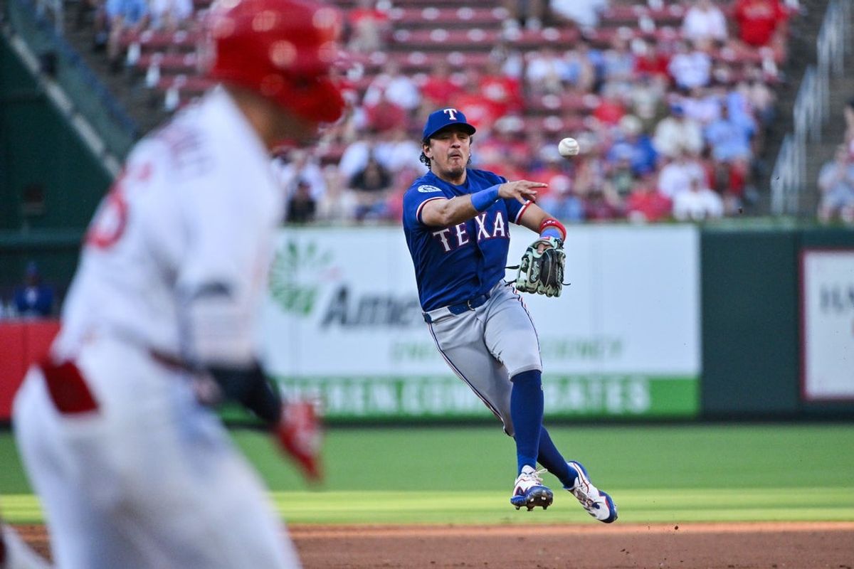 Jun 2, 2026; St. Louis, Missouri, USA; Texas Rangers second baseman Nicky Lopez (33) throws out St. Louis Cardinals second baseman JJ Wetherholt (26) during the second inning at Busch Stadium. Mandatory Credit: Jeff Curry-Imagn Images