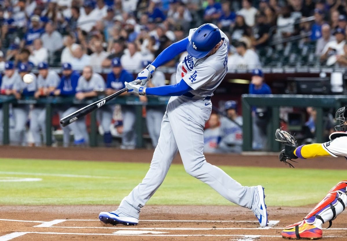 Jun 2, 2026; Phoenix, Arizona, USA; Los Angeles Dodgers first baseman Freddie Freeman hits a two run home run in the first inning against the Arizona Diamondbacks at Chase Field. Mandatory Credit: Mark J. Rebilas-Imagn Images