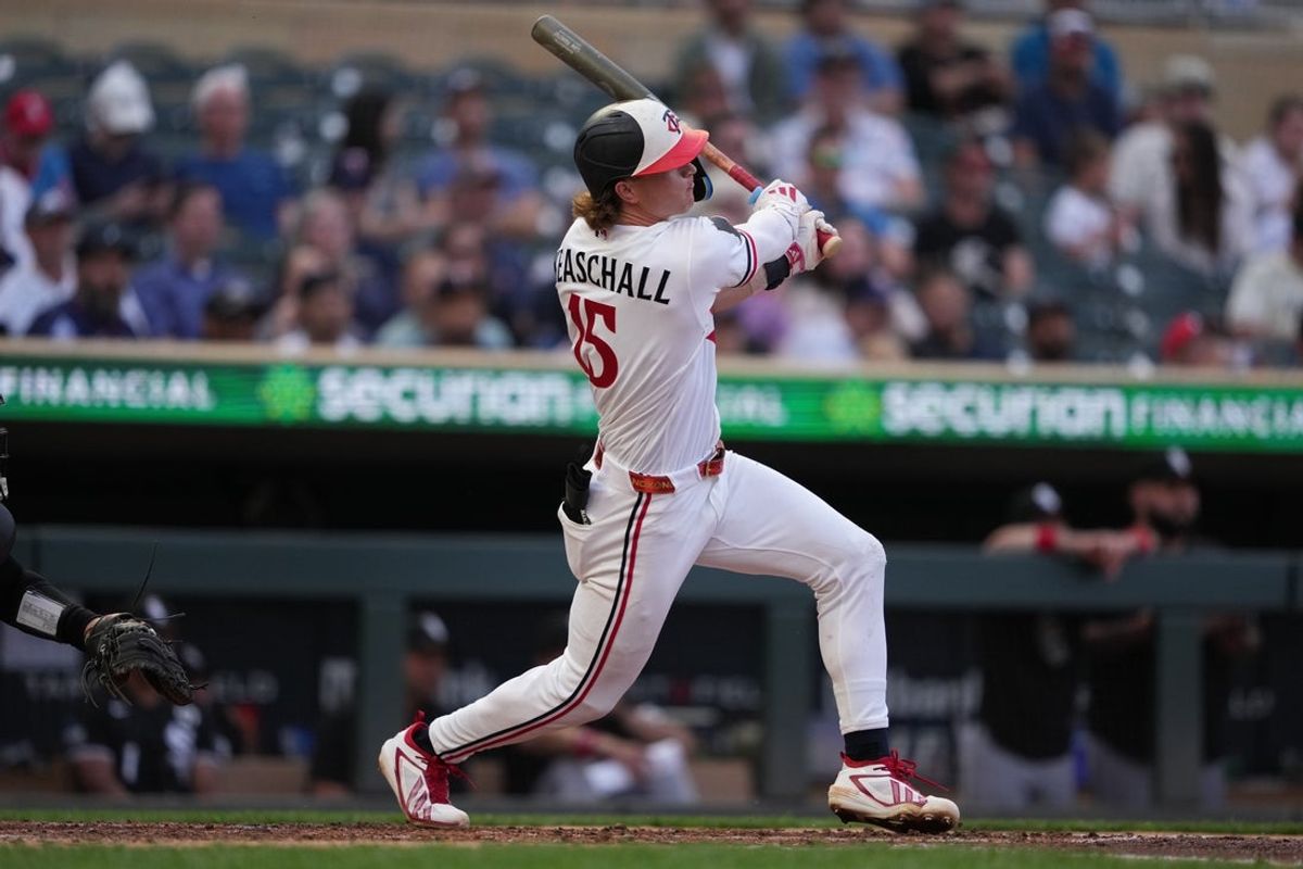 Jun 2, 2026; Minneapolis, Minnesota, USA; Minnesota Twins second baseman Luke Keaschall (15) hits a RBI double during the fourth inning against the Chicago White Sox at Target Field. Mandatory Credit: Jordan Johnson-Imagn Images