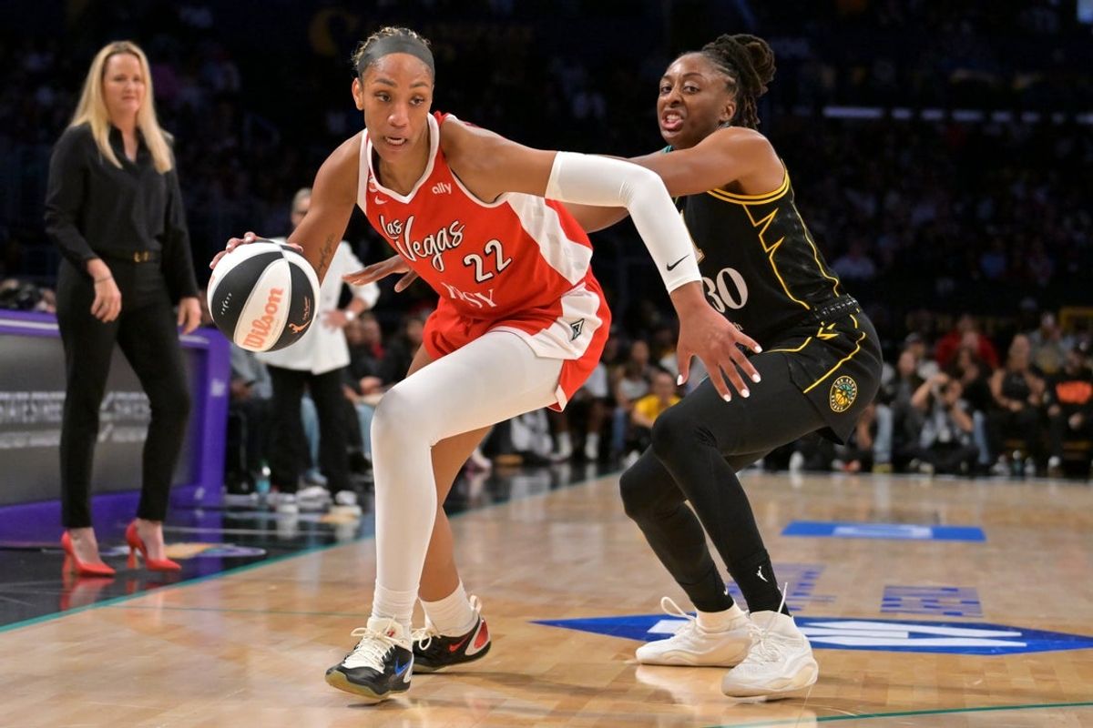 Jun 2, 2026; Los Angeles, California, USA;  Las Vegas Aces center A'ja Wilson (22) is defended by Los Angeles Sparks forward Nneka Ogwumike (30) as she drives to the basket during the first half at Crypto.com Arena. Mandatory Credit: Jayne Kamin-Oncea-Imagn Images