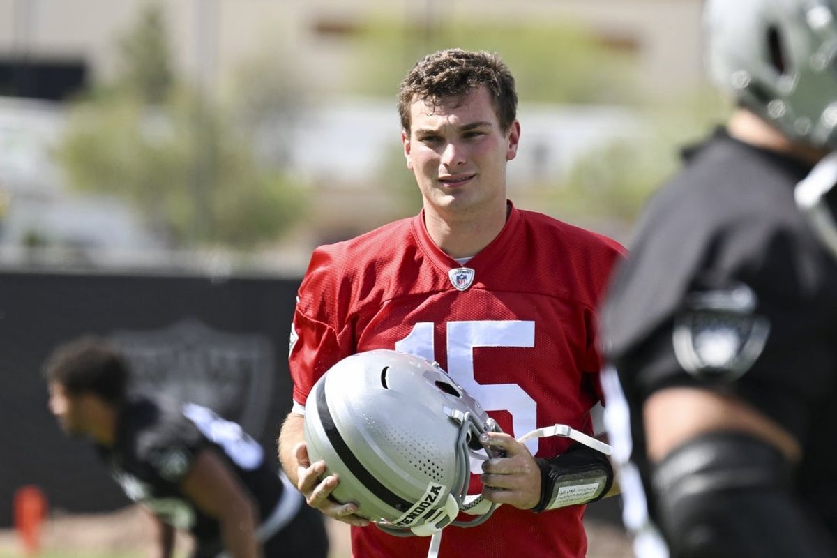 Jun 3, 2026; Henderson, NV, USA; Las Vegas Raiders quarterback Fernando Mendoza (15) warms up during organized team activities at Intermountain Health Performance Center. Mandatory Credit: Candice Ward-Imagn Images