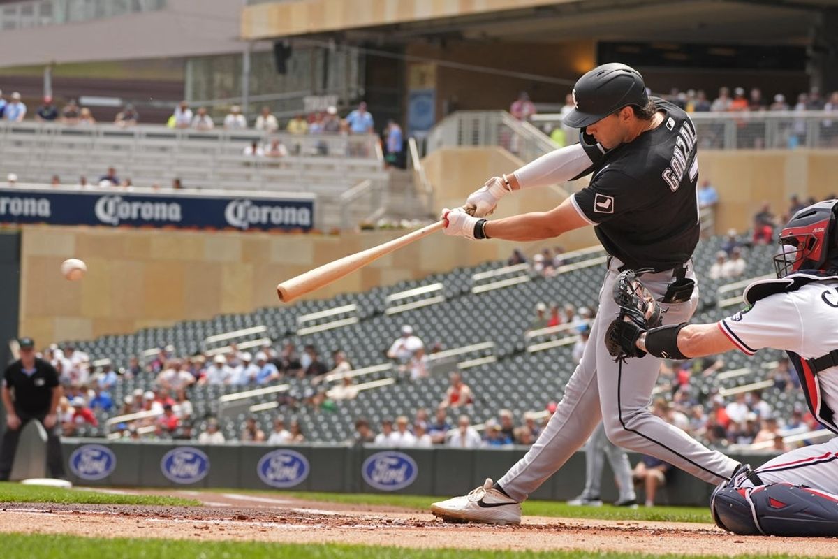Jun 3, 2026; Minneapolis, Minnesota, USA; Chicago White Sox first baseman Jacob Gonzalez (7) hits a two-run single against the Minnesota Twins in the first inning at Target Field. Mandatory Credit: Bruce Kluckhohn-Imagn Images