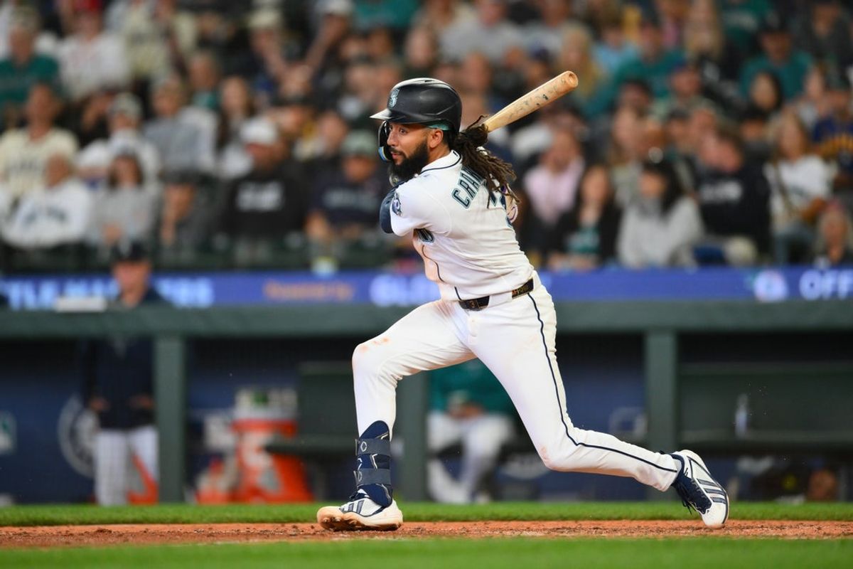 Jun 3, 2026; Seattle, Washington, USA; Seattle Mariners shortstop J.P. Crawford (3) hits a single against the New York Mets during the fifth inning at T-Mobile Park. Mandatory Credit: Steven Bisig-Imagn Images