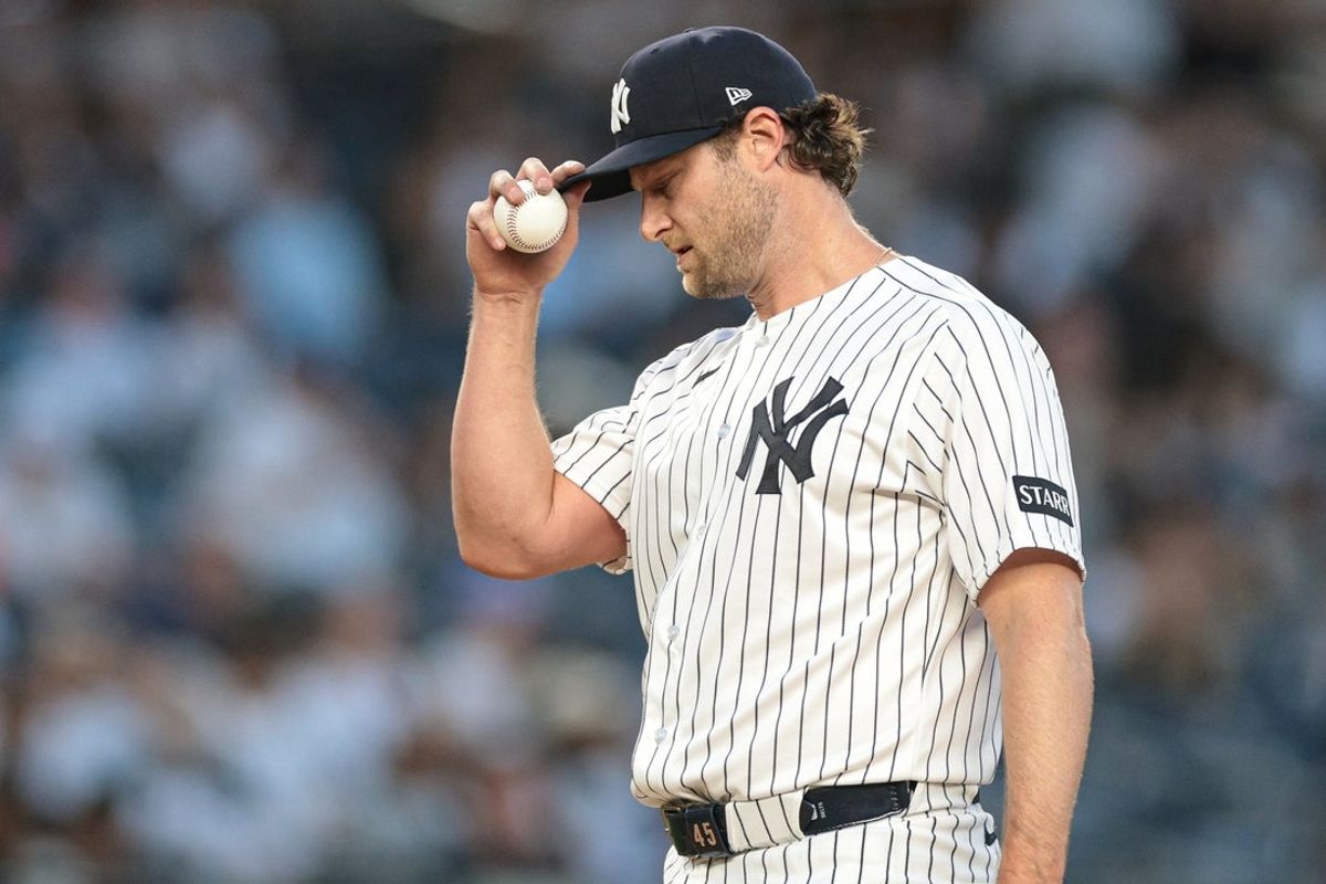 Jun 3, 2026; Bronx, New York, USA; New York Yankees pitcher Gerrit Cole (45) reacts after giving up a hit during the third inning against the Cleveland Guardians at Yankee Stadium. Mandatory Credit: Vincent Carchietta-Imagn Images
