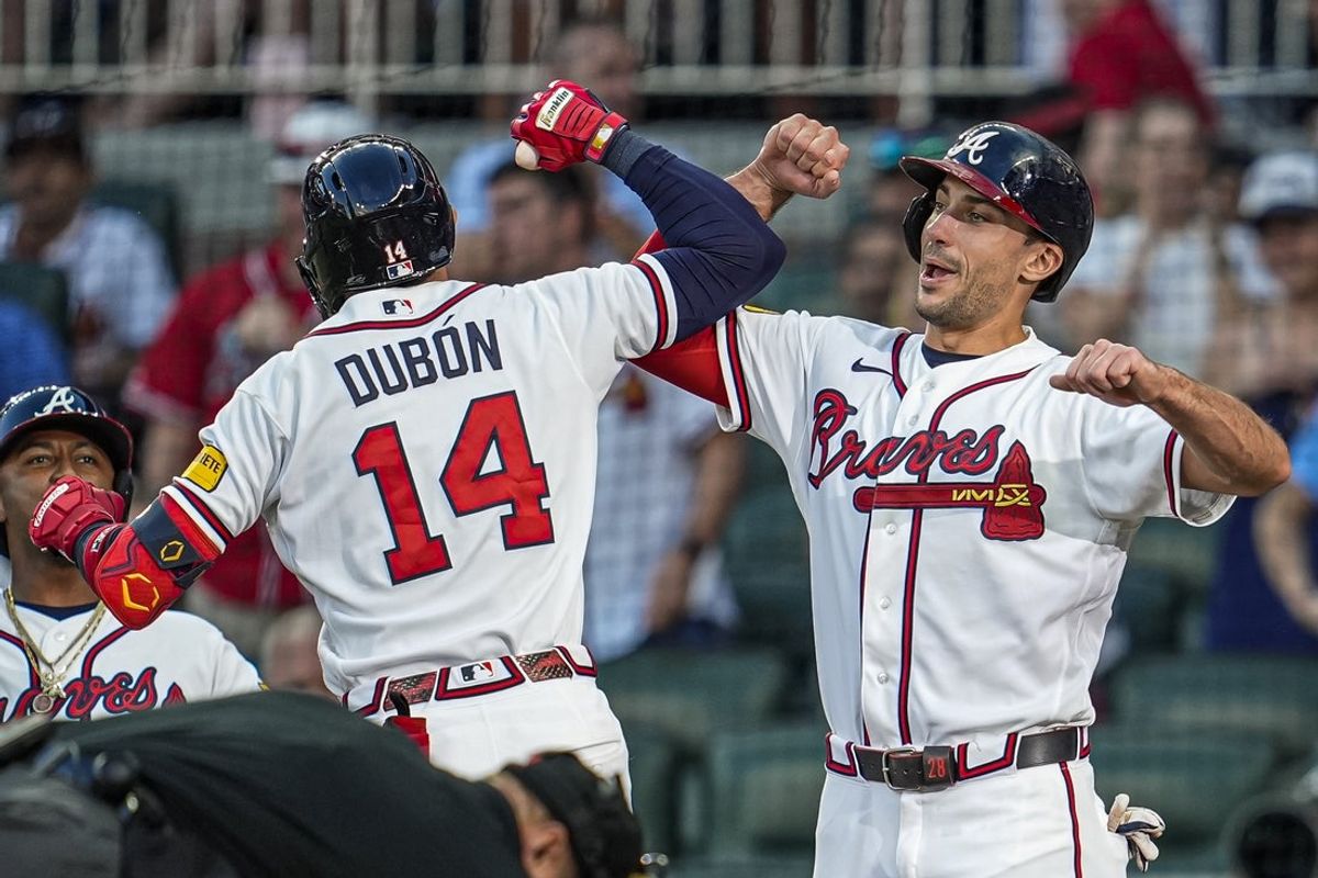 Jun 3, 2026; Cumberland, Georgia, USA; Atlanta Braves left fielder Mauricio Dubón (14) reacts with first baseman Matt Olson (28) after hitting a three run home run against the Toronto Blue Jays during the third inning at Truist Park. Mandatory Credit: Dale Zanine-Imagn Images