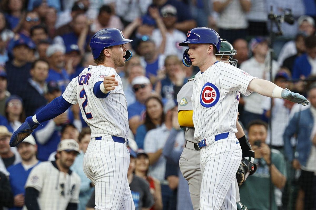 Jun 3, 2026; Chicago, Illinois, USA; Chicago Cubs center fielder Pete Crow-Armstrong (4) celebrates with second baseman Nico Hoerner (2) after hitting a two-run home run against the Athletics during the third inning at Wrigley Field. Mandatory Credit: Kamil Krzaczynski-Imagn Images