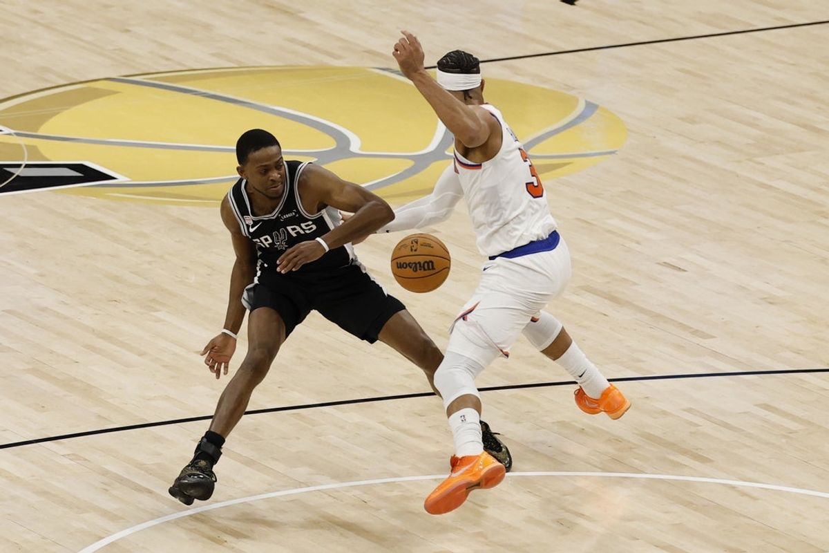 Jun 3, 2026; San Antonio, Texas, USA; New York Knicks guard Josh Hart (3) steals the bal from San Antonio Spurs guard De'aaron Fox (4) in the second half during game one of the 2026 NBA Finals at Frost Bank Center. Mandatory Credit: Geoff Burke-Imagn Images