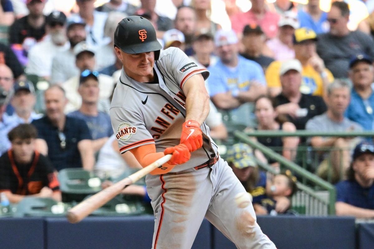Jun 4, 2026; Milwaukee, Wisconsin, USA; San Francisco Giants third baseman Matt Chapman (26) hits a single to drive in a run in the third inning against the Milwaukee Brewers at American Family Field. Mandatory Credit: Benny Sieu-Imagn Images
