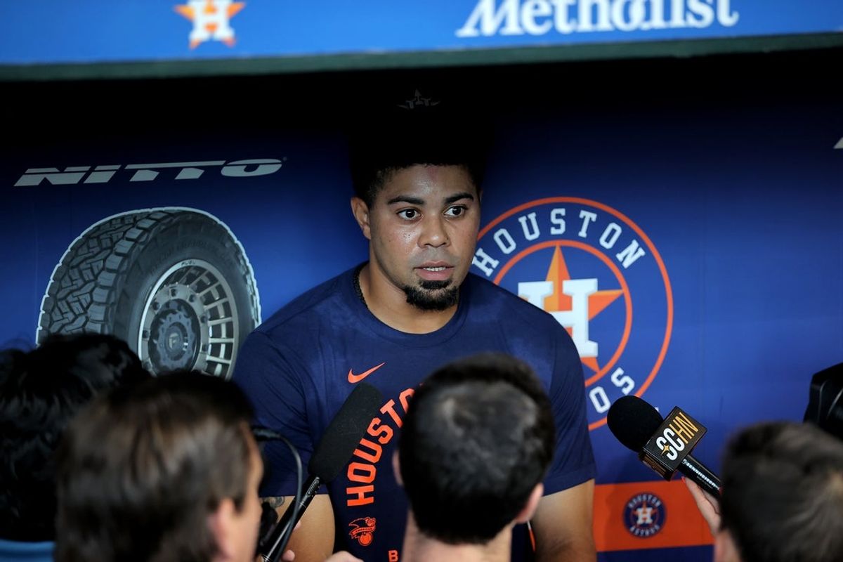 Jun 4, 2026; Houston, Texas, USA; Houston Astros left fielder LaMonte Wade Jr. (31) talks to media members in the dugout prior to the game against the Pittsburgh Pirates at Daikin Park. Mandatory Credit: Erik Williams-Imagn Images