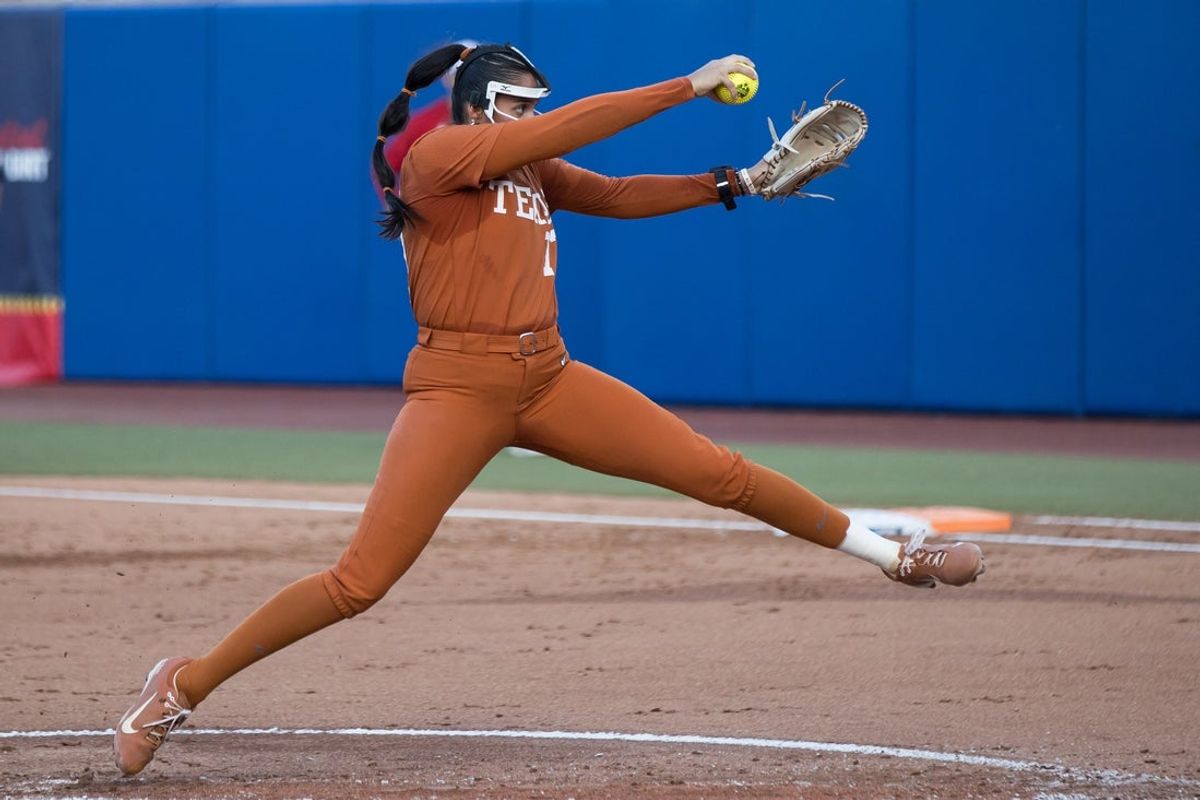 Jun 4, 2026; Oklahoma City, OK, USA;  Texas Longhorns pitcher Citlaly Gutierrez (77) throws a pitch in the second inning against the Texas Tech Red Raiders during Game Two of the NCAA Women’s College World Series championship series at Devon Park. Mandatory Credit: Brett Rojo-Imagn Images