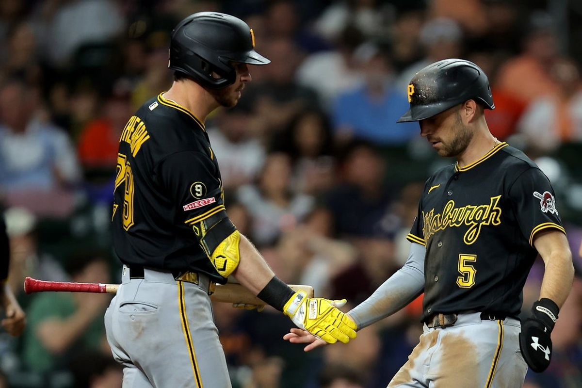 Jun 4, 2026; Houston, Texas, USA; Pittsburgh Pirates second baseman Brandon Lowe (5) celebrates with right fielder Ryan O'Hearn (29) after scoring a run against the Houston Astros during the sixth inning at Daikin Park. Mandatory Credit: Erik Williams-Imagn Images