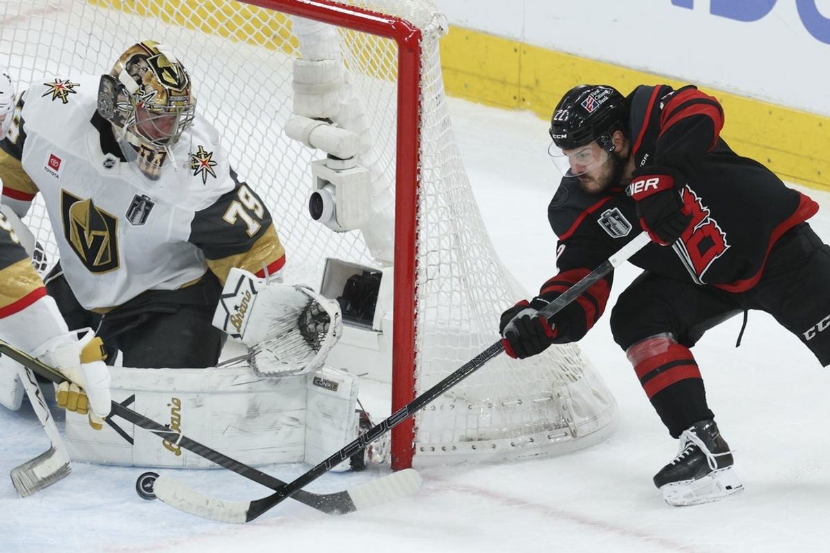 Jun 4, 2026; Raleigh, North Carolina, USA; Carolina Hurricanes center Logan Stankoven (22) scores against Vegas Golden Knights goaltender Carter Hart (79) during the third period against the Vegas Golden Knights in game two of the 2026 Stanley Cup Final at Lenovo Center. Mandatory Credit: Nathan Ray Seebeck-Imagn Images