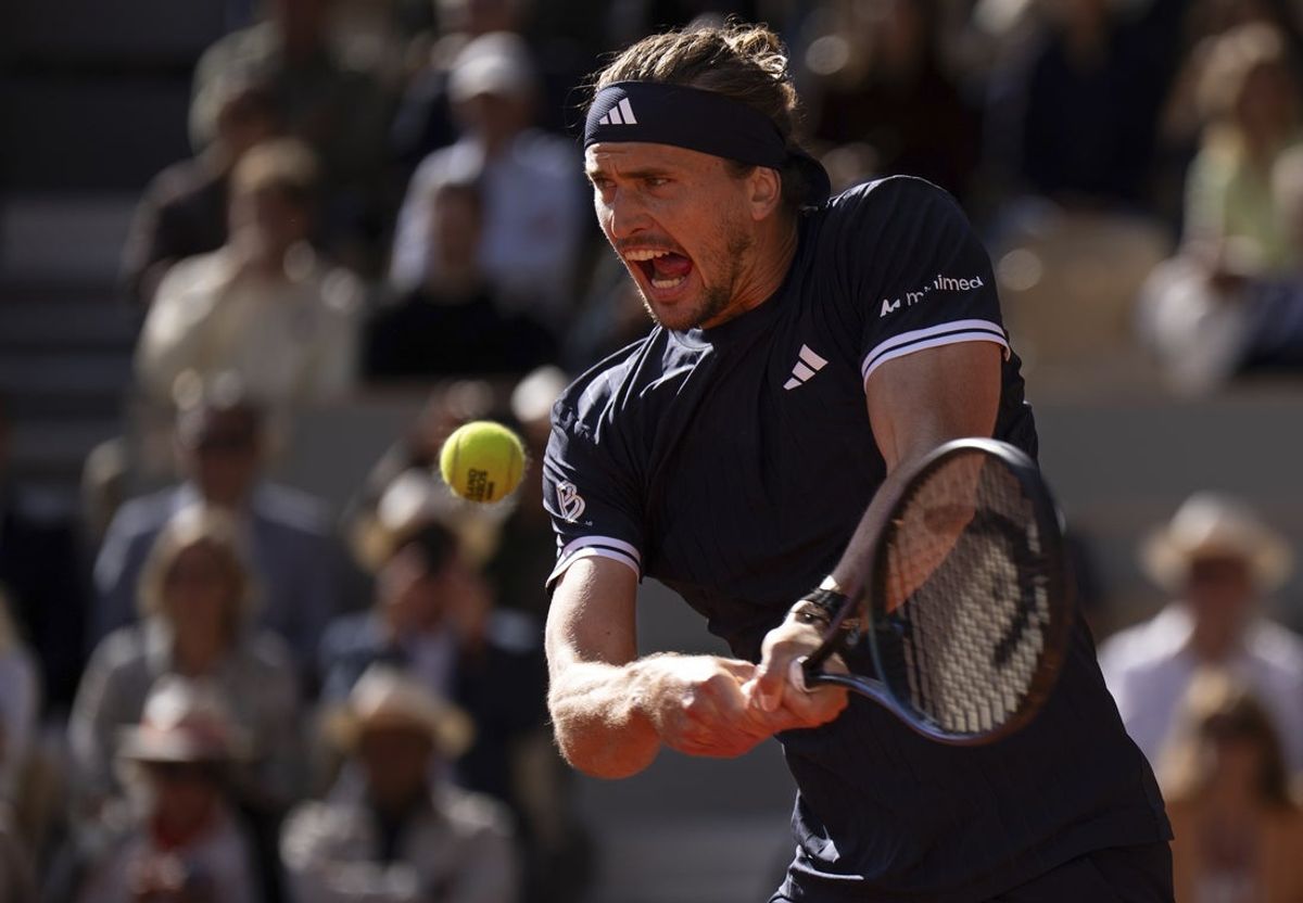 Jun 5, 2026; Paris, France;  Alexander Zverev of Germany returns a shot during his match against Jakub Mensik of Czechia on day 12 at Stade Roland Garros. Mandatory Credit: Susan Mullane-Imagn Images