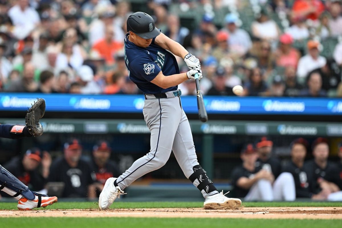 Jun 5, 2026; Detroit, Michigan, USA;  Seattle Mariners designated hitter Rob Refsnyder (30) hits an RBI single against the Detroit Tigers in the first inning at Comerica Park. Mandatory Credit: Lon Horwedel-Imagn Images