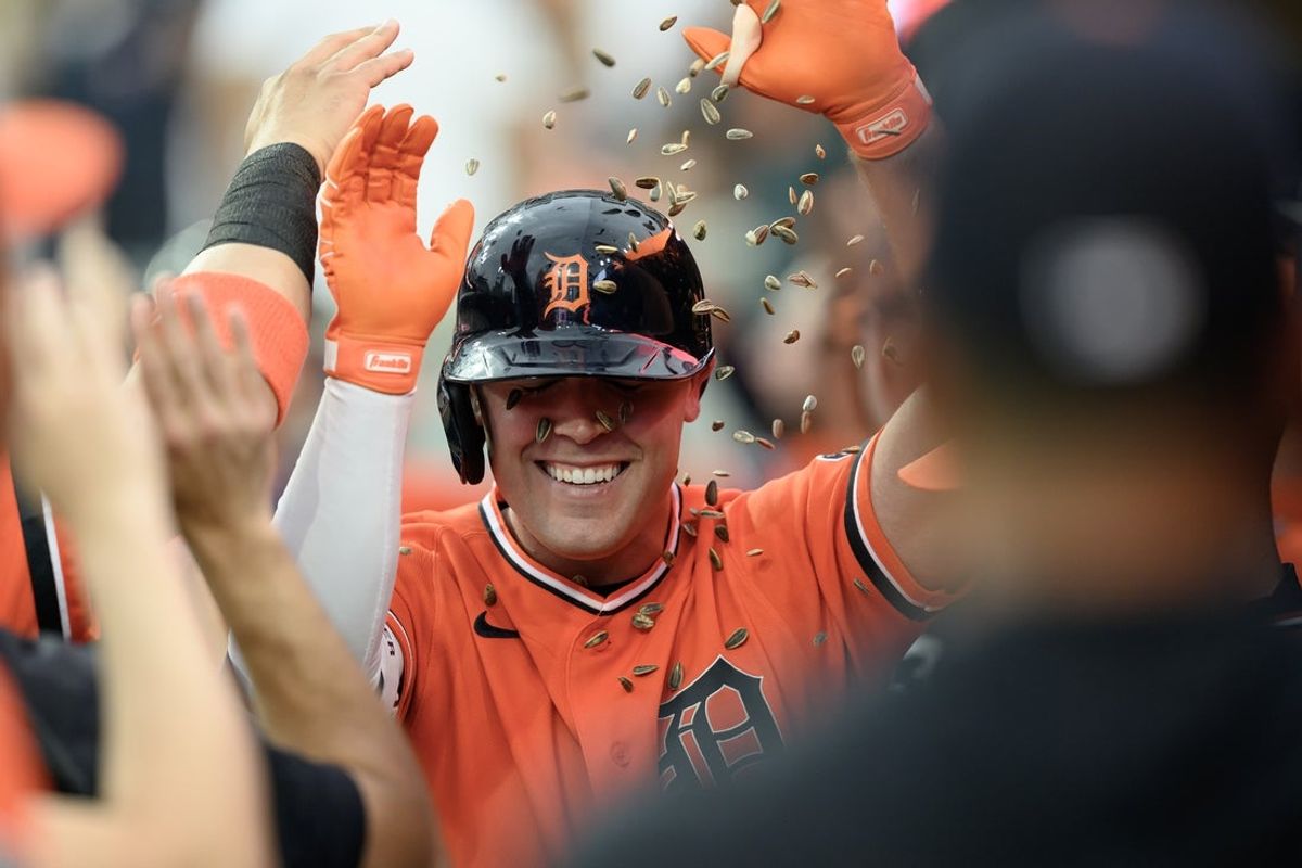 Jun 5, 2026; Detroit, Michigan, USA;  Detroit Tigers right fielder Kerry Carpenter (30) gets showered with sunflower seeds while celebrating in the dugout after hitting a two-run home run against the Seattle Mariners in the third inning at Comerica Park. Mandatory Credit: Lon Horwedel-Imagn Images