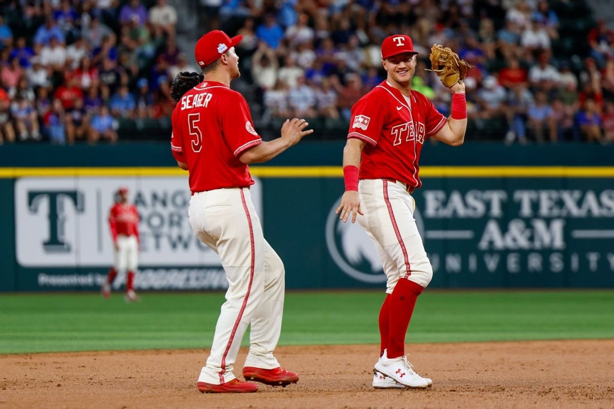 Jun 5, 2026; Arlington, Texas, USA; Texas Rangers third baseman Josh Jung (6) laughs after catching a pop up in front of Texas Rangers Shortstop Corey Seager (5) during the third inning against the Cleveland Guardians at Globe Life Field. Mandatory Credit: Andrew Dieb-Imagn Images