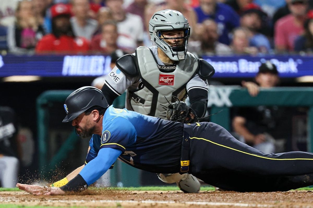 Jun 5, 2026; Philadelphia, Pennsylvania, USA; Philadelphia Phillies designated hitter Kyle Schwarber (12) scores on a slide past Chicago White Sox catcher Edgar Quero (26) during the seventh inning at Citizens Bank Park. Mandatory Credit: Bill Streicher-Imagn Images