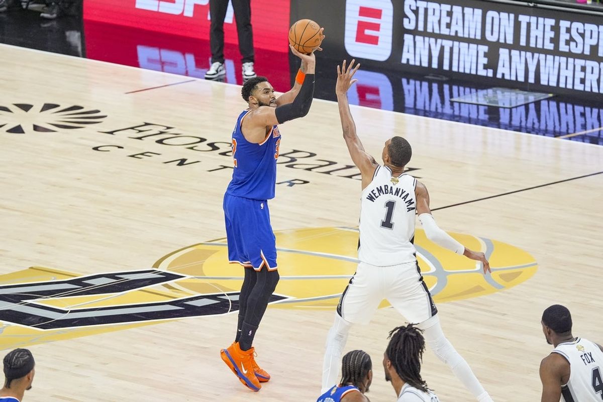 Jun 5, 2026; San Antonio, Texas, USA; New York Knicks center Karl-Anthony Towns (32) shoots the ball over San Antonio Spurs forward Victor Wembanyama (1) in the second quarter during game two of the 2026 NBA Finals at Frost Bank Center. Mandatory Credit: Daniel Dunn-Imagn Images