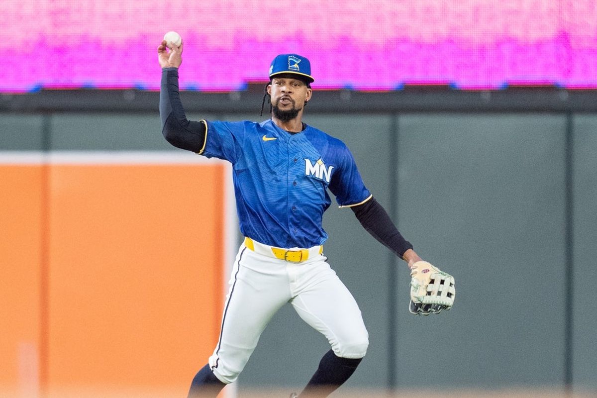 Jun 5, 2026; Minneapolis, Minnesota, USA; Minnesota Twins center fielder Byron Buxton (25) throws the ball to second base after catching a ball hit by Kansas City Royals second baseman Michael Massey (19) in the first inning at Target Field. Mandatory Credit: Matt Blewett-Imagn Images