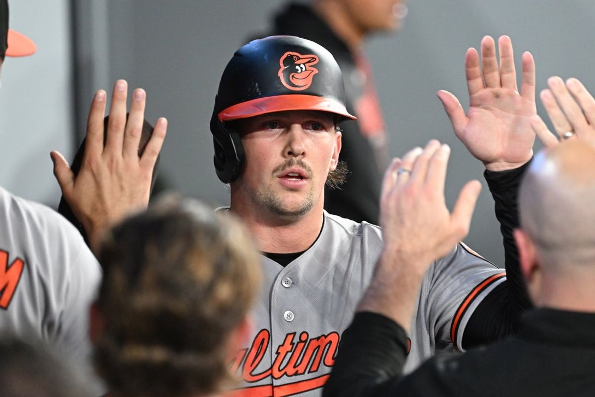 Jun 5, 2026; Toronto, Ontario, CAN;  Baltimore Orioles catcher Adley Rutschman (35) celebrates with team mates in the dugout after scoring a run against the Toronto Blue Jays in the sixth inning at Rogers Centre. Mandatory Credit: Dan Hamilton-Imagn Images