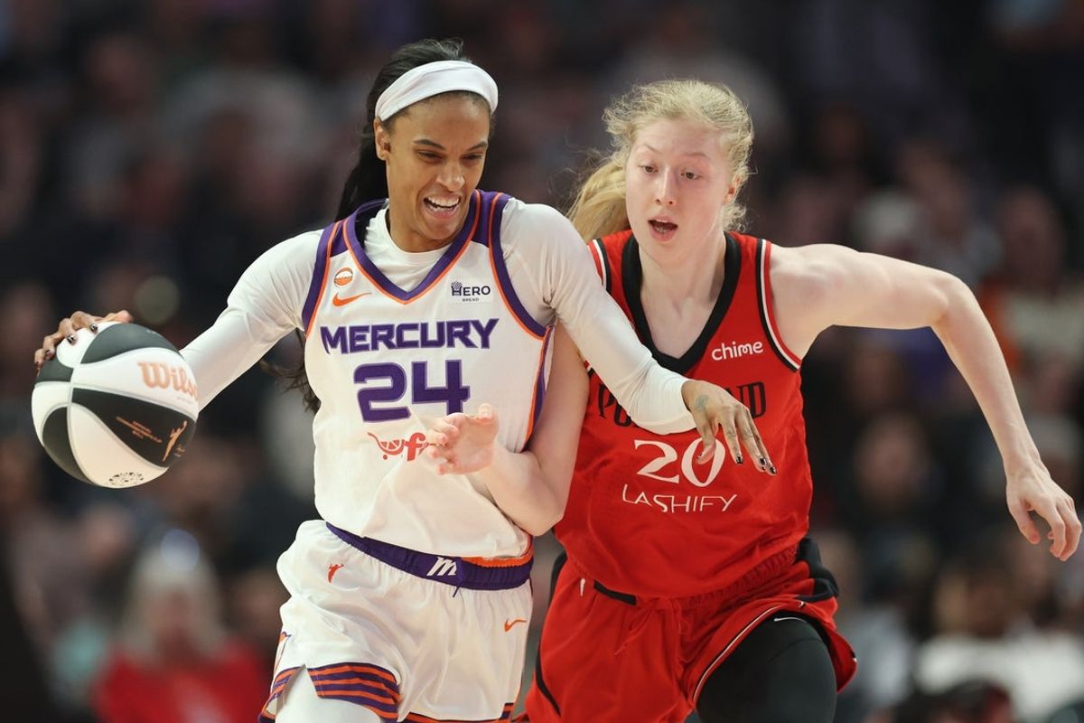 Jun 5, 2026; Portland, Oregon, USA; Phoenix Mercury forward-guard DeWanna Bonner (24) dribbles against Portland Fire forward Frieda Buhner (20) during the first half at Moda Center. Mandatory Credit: Soobum Im-Imagn Images