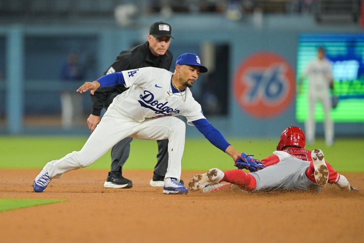 Jun 5, 2026; Los Angeles, California, USA;  Los Angeles Angels shortstop Zach Neto (9) beats the tag from Los Angeles Dodgers shortstop Mookie Betts (50) to steal second base during the sixth inning at Dodger Stadium. Mandatory Credit: Jayne Kamin-Oncea-Imagn Images