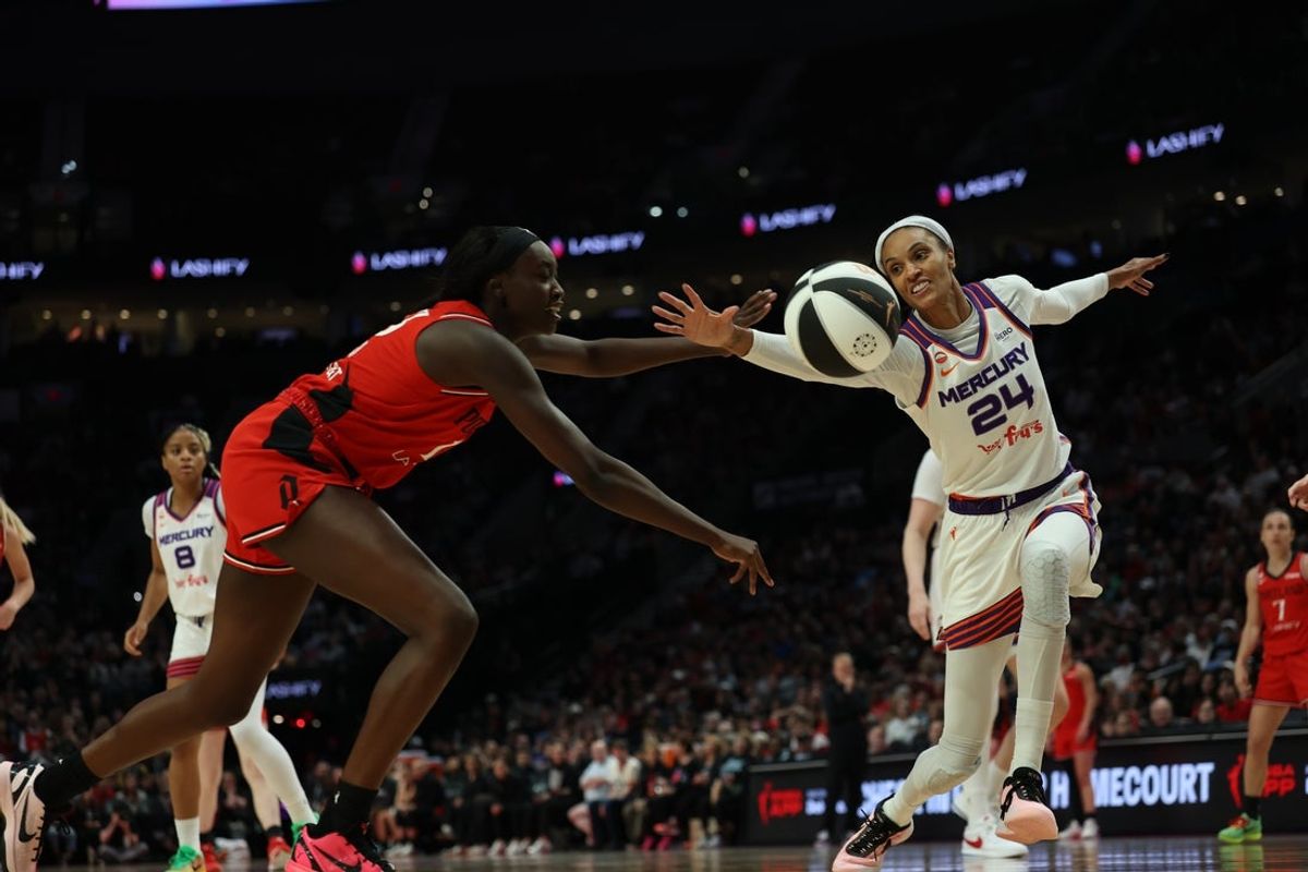 Jun 5, 2026; Portland, Oregon, USA; Phoenix Mercury forward DeWanna Bonner (24) and Portland Fire forward Nyadiew Puoch (13) battle for a loose ball during the second half at Moda Center. Mandatory Credit: Soobum Im-Imagn Images
