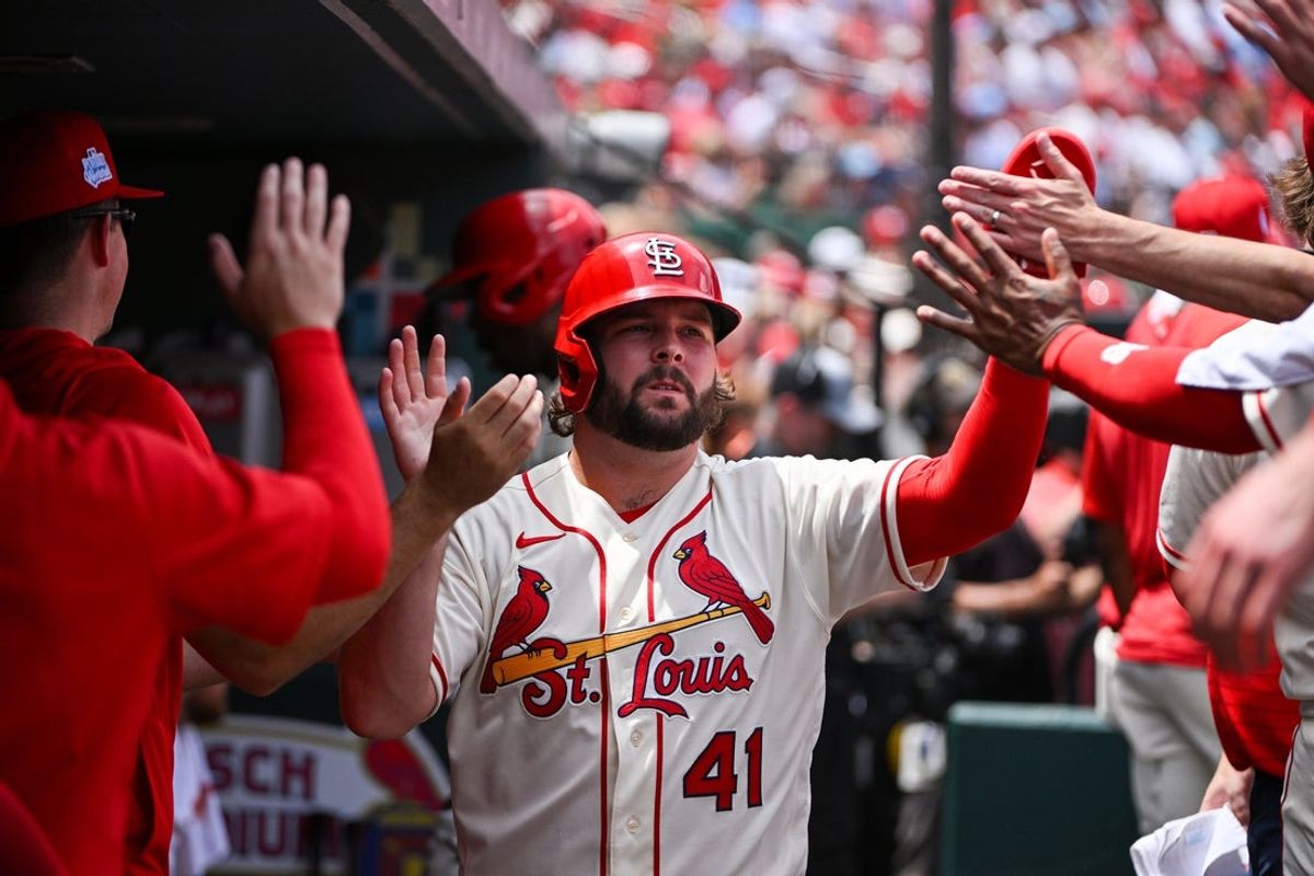 Jun 6, 2026; St. Louis, Missouri, USA; St. Louis Cardinals first baseman Alec Burleson (41) is congratulated by teammates after scoring against the Cincinnati Reds during the second inning at Busch Stadium. Mandatory Credit: Jeff Curry-Imagn Images