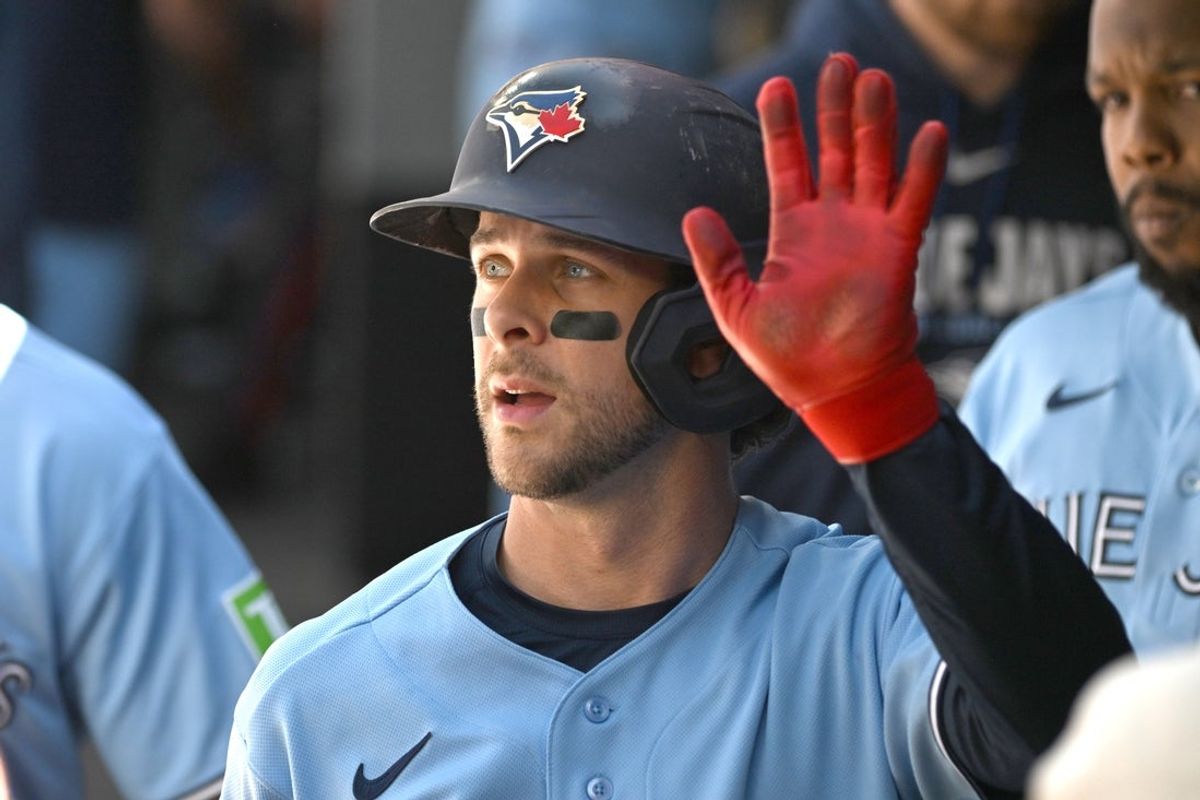 Jun 6, 2026; Toronto, Ontario, CAN;  Toronto Blue Jays second baseman Ernie Clement (22) celebrates in the dugout with team mates after scoring a run against the Baltimore Orioles in the second inning at Rogers Centre. Mandatory Credit: Dan Hamilton-Imagn Images